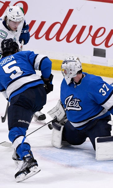 Hellebuyck's 41 saves leads Jets past Canucks 4-0